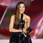 Michelle Yeoh receiving her first Golden Globe for her performance in “Everything Everywhere All at Once" at 81st Golden Globe Awards 2024